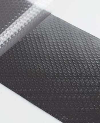 Tecman72204 TIM Black Textured With Liner Peeling Off Macro Shot